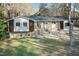 Ranch-style home with landscaping and driveway at 5829 Sandstone Dr, Durham, NC 27713