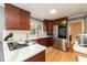 Updated kitchen with stainless steel appliances and wood cabinets at 5829 Sandstone Dr, Durham, NC 27713