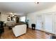 Living area with hardwood floors, fireplace and French doors at 5829 Sandstone Dr, Durham, NC 27713