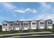 Exterior view of six townhomes with attached garages and landscaping at 6667 Gibraltar Rock Dr # 1088F, Raleigh, NC 27610