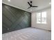 Spacious bedroom with gray accent wall and wall-to-wall carpet at 144 Chanute Cir, Louisburg, NC 27549