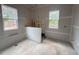 Under-construction bathroom with designated areas for shower, fixtures, and finishes at 1721 Burnette Garden Path, Raleigh, NC 27612