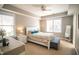 Main bedroom with floral bedding and gray bench at 2220 Dunlin Ln, Raleigh, NC 27614