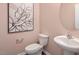 Small bathroom with white vanity, toilet and oval mirror at 2239 Horton Park Dr, Apex, NC 27539