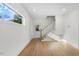 Unfinished basement space with a staircase and exterior access at 2503 Lednum St, Durham, NC 27704