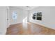 Bright bedroom with hardwood floors and large windows at 2503 Lednum St, Durham, NC 27704