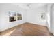 Spacious bedroom with hardwood floors and multiple windows at 2503 Lednum St, Durham, NC 27704