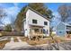 Modern two-story home with white siding and a detached garage at 2503 Lednum St, Durham, NC 27704
