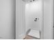 Bright laundry room with built-in shelving and tile floor at 2503 Lednum St, Durham, NC 27704