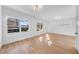 Open living room with hardwood floors, large windows and recessed lighting at 2503 Lednum St, Durham, NC 27704