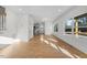 Sunlit living room featuring hardwood floors and access to kitchen at 2503 Lednum St, Durham, NC 27704