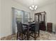 Bright dining area with table, chairs, and a china cabinet at 272 Woodwater Cir, Lillington, NC 27546