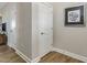 Light and bright hallway with neutral walls and wood floors at 317 Whitley Ridge Dr, Clayton, NC 27527