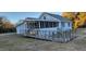 Front exterior of a house with a wooden ramp leading to a screened porch at 332 Bass Lake Road Rd, Holly Springs, NC 27540