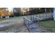 Wooden ramp leading to a house, with grass in the foreground at 332 Bass Lake Road Rd, Holly Springs, NC 27540