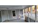 Screened porch with a door leading into the home at 332 Bass Lake Road Rd, Holly Springs, NC 27540
