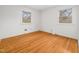 Spacious bedroom with hardwood floors and two windows at 3428 Starmount Dr, Raleigh, NC 27604