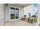 Covered patio with seating area and sliding glass door at 35 Fair Child Rd, Spring Lake, NC 28390