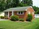 Red brick ranch house with a spacious yard at 608 N Ellis Ave, Dunn, NC 28334