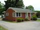 Side view of a red brick ranch house at 608 N Ellis Ave, Dunn, NC 28334