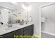 Double vanity bathroom with gray cabinets and quartz countertop at 117 Deer Cross Dr, Louisburg, NC 27549