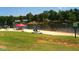 Lakefront community beach with sandy shoreline, picnic area, and swimming at 117 Deer Cross Dr, Louisburg, NC 27549