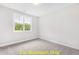 Simple bedroom with carpet and large window at 117 Deer Cross Dr, Louisburg, NC 27549