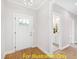 Bright entryway with hardwood floors and access to half bath at 117 Deer Cross Dr, Louisburg, NC 27549