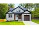 Craftsman style home with two-car garage and landscaped lawn at 117 Deer Cross Dr, Louisburg, NC 27549