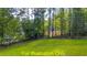 Wooded lot with grassy area, offering a private and natural setting at 117 Deer Cross Dr, Louisburg, NC 27549