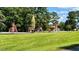 playground featuring slides, swings, and climbing structures at 117 Deer Cross Dr, Louisburg, NC 27549