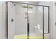 Modern shower with built-in seat and glass enclosure at 117 Deer Cross Dr, Louisburg, NC 27549