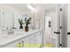 Modern bathroom with double vanity and a mirror at 212 Rawhide Dr, Louisburg, NC 27549