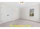 Simple bedroom with carpet and a large window at 212 Rawhide Dr, Louisburg, NC 27549