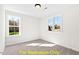 Bright bedroom with two windows and carpet at 212 Rawhide Dr, Louisburg, NC 27549
