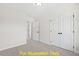 Bright bedroom with double door closet and access to hallway at 212 Rawhide Dr, Louisburg, NC 27549