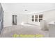Spacious bonus room with multiple windows and wall-to-wall carpet at 212 Rawhide Dr, Louisburg, NC 27549