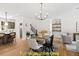 Bright dining area with hardwood floors and a six-person table at 212 Rawhide Dr, Louisburg, NC 27549
