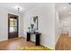 Bright entryway with hardwood floors and console table at 212 Rawhide Dr, Louisburg, NC 27549