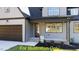 Two-story house exterior with a brown door and garage at 212 Rawhide Dr, Louisburg, NC 27549