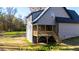 Gray two-story house with a deck and backyard at 212 Rawhide Dr, Louisburg, NC 27549