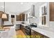 Modern kitchen with stainless steel appliances and white quartz countertops at 212 Rawhide Dr, Louisburg, NC 27549