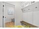 Convenient laundry room with built-in bench and shelving at 212 Rawhide Dr, Louisburg, NC 27549