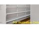 Walk-in pantry with ample shelving for storage at 212 Rawhide Dr, Louisburg, NC 27549