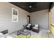 Cozy screened porch with seating area and ceiling fan at 212 Rawhide Dr, Louisburg, NC 27549
