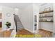 Modern staircase with gray carpeting and metal railing at 212 Rawhide Dr, Louisburg, NC 27549