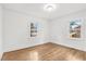 Spacious bedroom with hardwood floors and large windows at 303 Forest Rd, Oxford, NC 27565