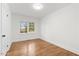 Bright bedroom with hardwood floors and a window at 303 Forest Rd, Oxford, NC 27565