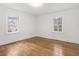 Well-lit bedroom featuring hardwood floors and ample space at 303 Forest Rd, Oxford, NC 27565