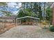 Gravel carport with a metal frame at 303 Forest Rd, Oxford, NC 27565